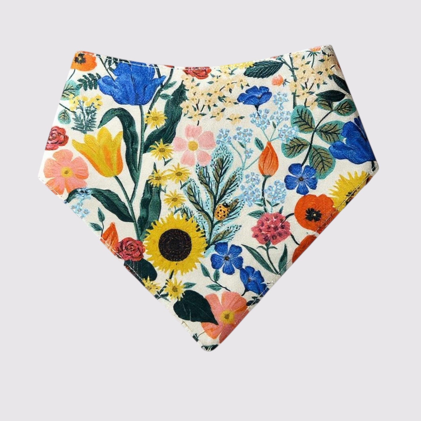 Colorful SnapBand dog bandana with a single snap button closure, featuring a vibrant lion and leaf pattern on soft fabric, available in sizes XXS to 3XL. (Rifle paper Co. Curio ,Blossom, blush front"