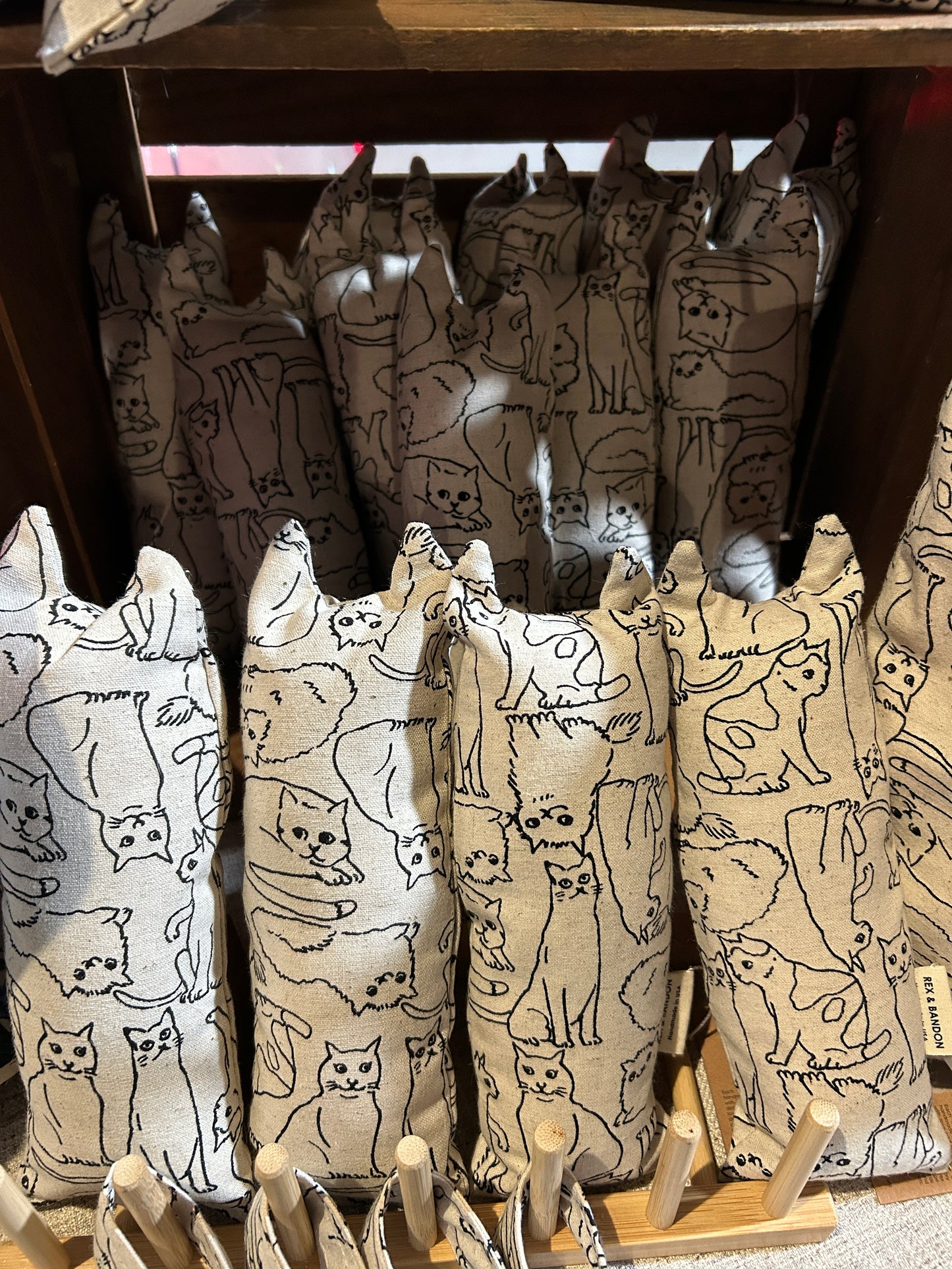 Stack of folded paper bags with animal pattern on a wooden surface