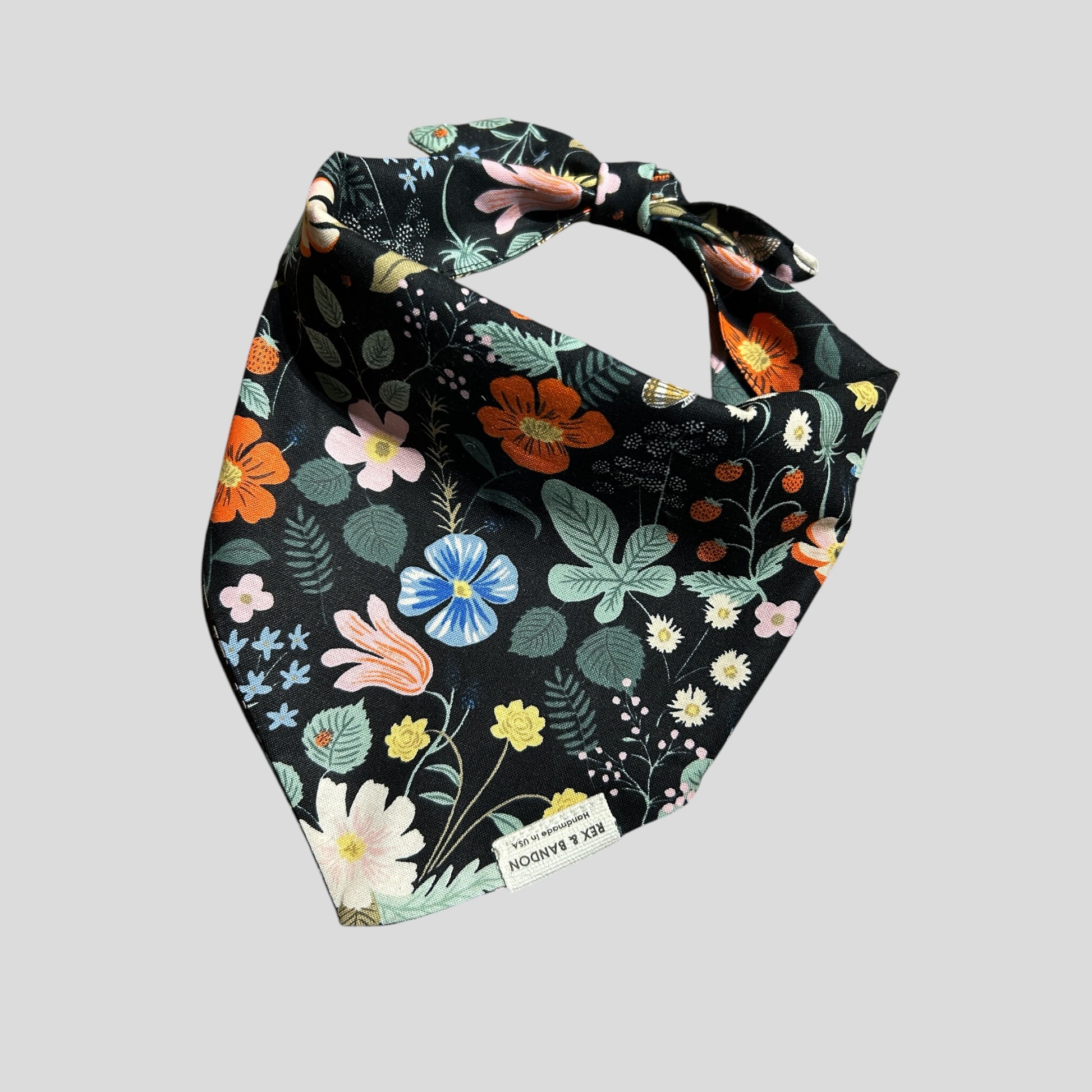 Floral-patterned bandana on a light black background