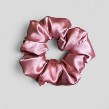 Load image into Gallery viewer, Pink satin scrunchie on a light gray background