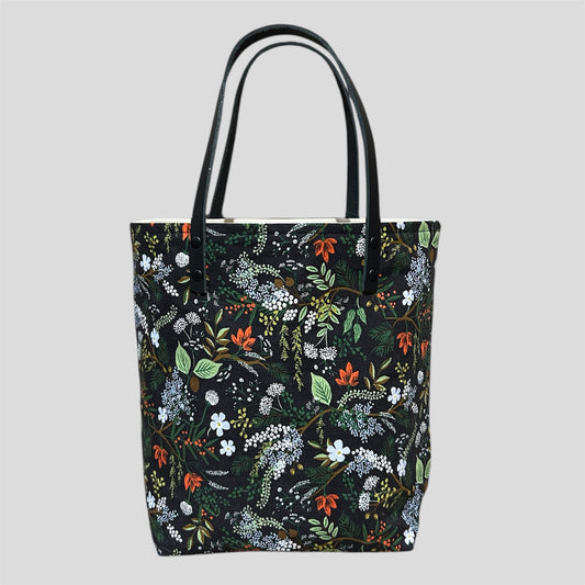 Floral patterned tote bag on a black background