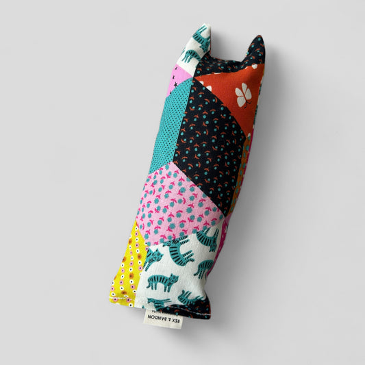 Colorful fabric patchwork product on a light gray background