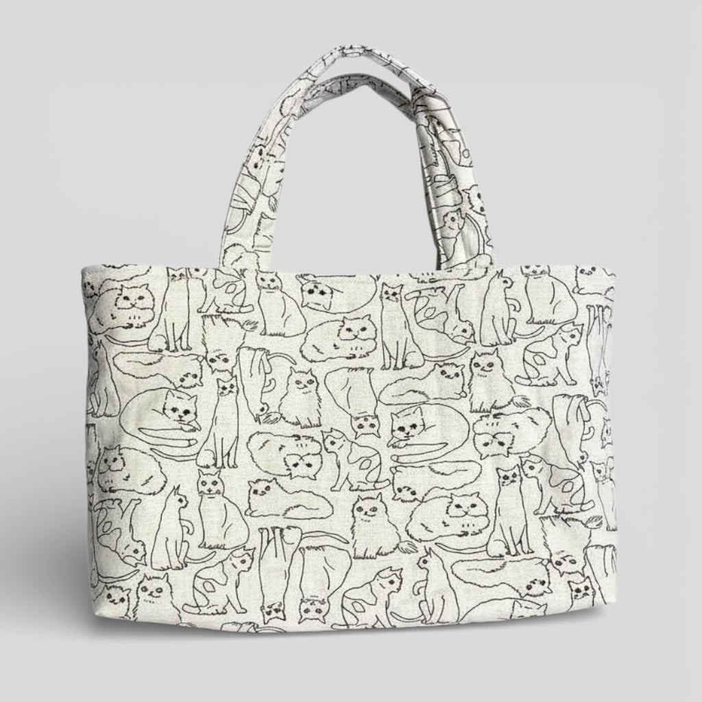 Tote bag with cat pattern on a gray background