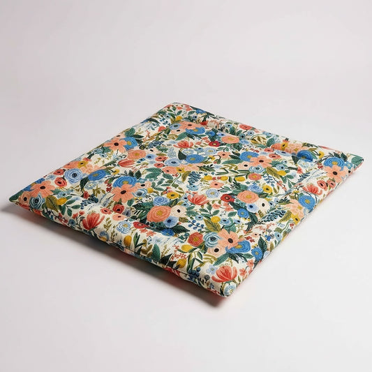 Floral-patterned fabric on a light gray background