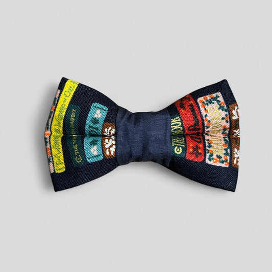 Bow tie with colorful patterns on a light gray background
